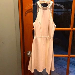 Ivory Lulu’s mini dress. Size S. Lace detail straps in back. Button closure.
